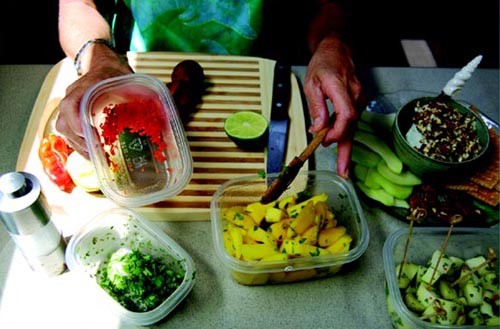 The red bits are Scotch Bonnet pepper being added to some Mango Chow in the foreground. The Happy Hour Blue Cheese Spread is on the back right, Pickled Christophene Cubes middle right.tif	 ©  SW